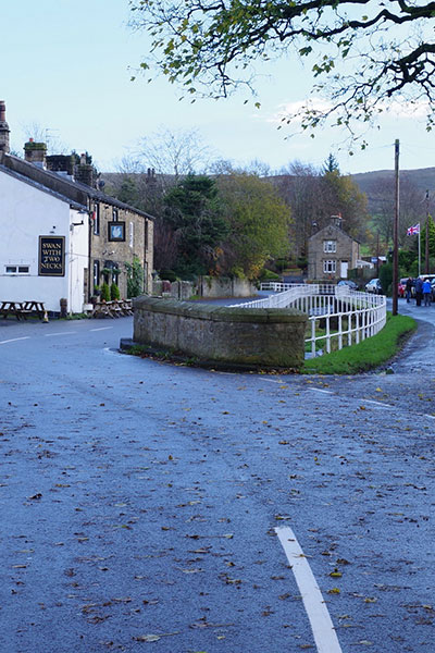 roadside junction in Pendleton with cars parked either side