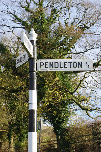 road sign showing the way to Pendleton and Sabden